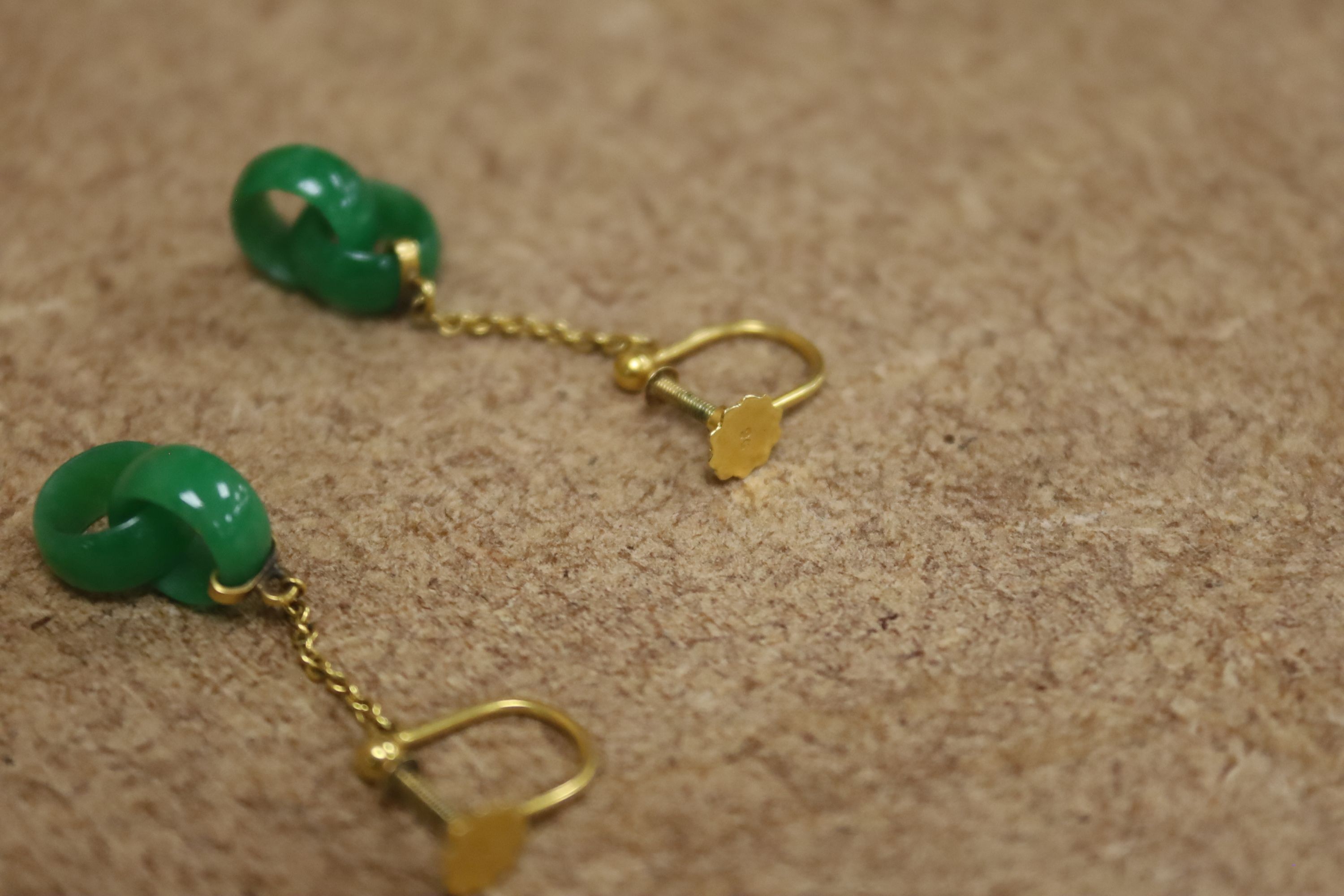 A pair of early to mid 20th century 9c yellow metal and jade double loop drop ear clips, drop 27mm, gross weight 1.8 grams.